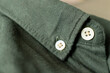 Close up of a mens shirts. Button On Shirt. Clothing background. Full frame