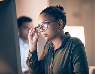 Wall Mural - serious black woman, computer and reading email, code or corporate information at night by the offic
