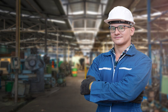 portrait of manual man worker is standing with confident with blue working suite dress and safety he