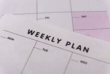 Weekly Planner. Calendar Reminder, Organizer, Schedule, Planning Concept. Close-up Of Weekly Plan Paper