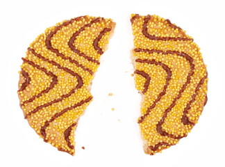 Wall Mural - Cookies broken, pieces with milk chocolate drizzle, yellow sprinkles and butter isolated on white, top view