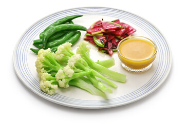 Wall Mural - Three kinds of vegetable salad; baby stick cauliflower, watermelon radish, and snap peas