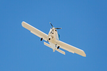 Ground view of a small plane flying in Turkey