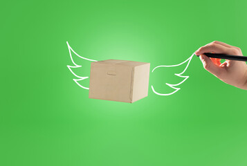 Wall Mural - A courier package, a cardboard box with painted wings, a flying package. Parcel delivery concept, courier work and logistic companies.