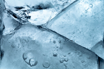 Wall Mural - Abstract ice background. Blue background with cracks on the ice surface