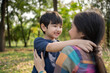 © Chalermphon - Happy Asian mother having fun with her son outdoors - Family and love concept. Mother’s day celebration.