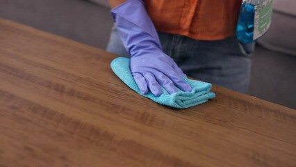 Sticker - Woman, hands and cleaning wooden table with detergent for housekeeping, hygiene or disinfection at home. Hand of female cleaner spraying clean chemical for dirt removal, sanitizing or wiping counter