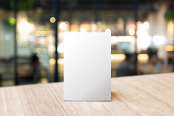 mock up label the blank menu frame in bar restaurant. stand for booklet with white sheet paper acryl