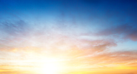 Wall Mural - sunset sky in the morning with colorful orange sunrise on blue white clouds sky background