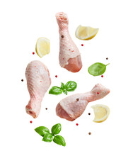 Raw Flying Chicken Drumstick And Spices Cut Out On Transparent Background