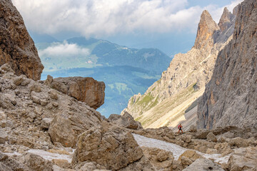 Wall Mural - Mountain Hikers in a wild mountain landscape looking toward the view