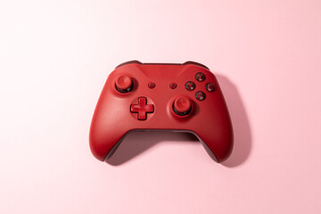 Sticker - red joystick gamepad, game console on pink colourful trendy modern fashion pin-up background. Computer gaming competition videogame control