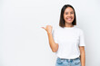 © luismolinero - Young caucasian woman isolated on white background pointing to the side to present a product