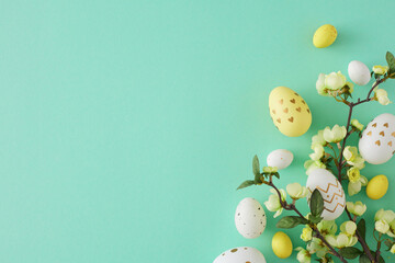Wall Mural - Easter decoration concept. Flat lay photo of colorful easter eggs cherry blossom branch on teal background with empty space
