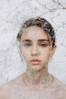 © Ananass - Stylish portrait of a young girl with gypsophila flowers and natural light, natural girlish beauty without makeup, minimalism and sophistication.