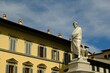 Dante . Dante Alighieri in Florence.Statue of Dante in Piazza Santa Croce. Blue sky background. 