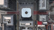 Top Down Aerial Shot Of Ice Skaters In Urban City Square. Beautiful Winter Time Tradition, Ice Skating Rink In America.