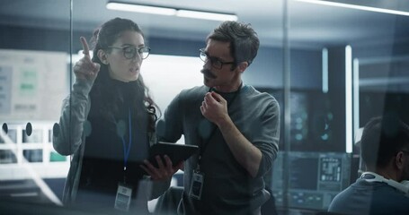 Poster - Portrait of Two Creative Young Female and Male Engineers Using Tablet Computer to Analyze and Discuss How to Proceed with the Artificial Intelligence Software. Standing in High Tech Research Office