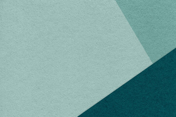 Texture of craft cyan color paper background with teal and emerald border. Vintage abstract cardboard.