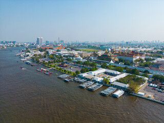 Fototapete - Aerial view city of Bangkok riverside with building and buddha temple