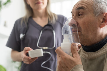 elderly senior man nursing care wear oxygen inhaler device for helping breath respiratory. oxygen co