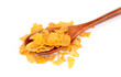 corn flakes on a wooden spoon on a white background