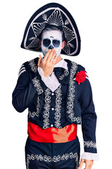 Poster - Young man wearing day of the dead costume over background bored yawning tired covering mouth with hand. restless and sleepiness.