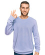 © Krakenimages.com - Young caucasian man wearing casual clothes smiling positive doing ok sign with hand and fingers. successful expression.