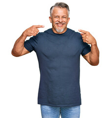 Sticker - Middle age grey-haired man wearing casual clothes smiling cheerful showing and pointing with fingers teeth and mouth. dental health concept.