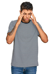 Canvas Print - Young handsome african american man wearing casual clothes with hand on head for pain in head because stress. suffering migraine.