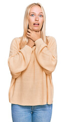 Sticker - Young blonde girl wearing casual clothes shouting and suffocate because painful strangle. health problem. asphyxiate and suicide concept.