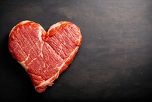 Heart Shape Raw Fresh Beef Steak On Metal Background