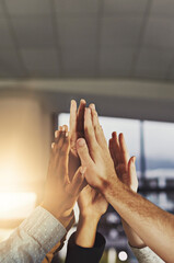 Sticker - Heres to a job well done. Shot of a group of colleagues giving each other a high five.