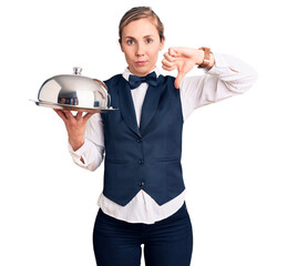 Sticker - Young beautiful blonde woman wearing waitress uniform holding tray with angry face, negative sign showing dislike with thumbs down, rejection concept