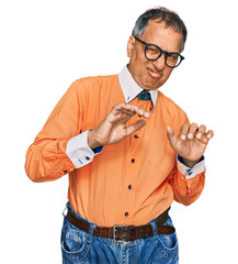 Poster - Middle age indian man wearing casual clothes and glasses disgusted expression, displeased and fearful doing disgust face because aversion reaction. with hands raised