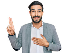 Young Hispanic Man Wearing Business Clothes Smiling Swearing With Hand On Chest And Fingers Up, Making A Loyalty Promise Oath