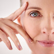 © Jeff Bergen/peopleimages.com - Impressed with the results of her anti-aging cream. Closeup studio portrait of an attractive mature woman.