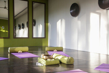 Blissful meditation studios to stop and feel zen. Empty yoga studio, mats, pillows and accessories, spacious meditation room 