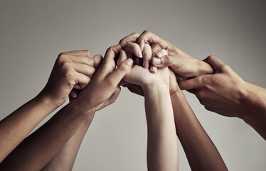Poster - As a team. Cropped shot of unrecognizable businesspeople coming together as a team.