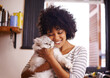 © Mapodile/peopleimages.com - Arent you so cute. Shot of a beautiful young woman enjoying a cuddle with her cat.