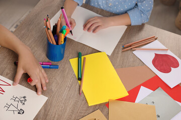 Wall Mural - Children making beautiful greeting cards at table indoors, closeup