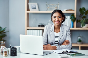 Wall Mural - My ambition doesnt have an off switch. Portrait of a young businesswoman working at her desk in a modern office.