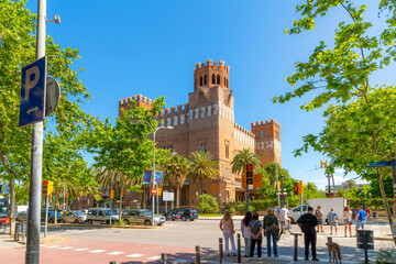 tourists wait to cross a street at the castle of the three dragons built between 1887–1888 for the 1