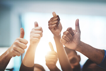 Poster - Keep up the amazing work. Cropped shot of a team of colleagues showing thumbs up at work.