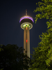 illuminated and colorful tower of the americas in san antonio, texas, usa, during night.