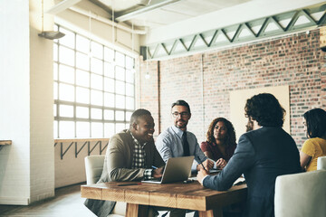 Aufkleber - Every idea is worth listening to. Shot of a diverse group of businesspeople having a meeting around a table in their office.