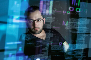 careful not to get lost in the code. cropped shot of a young computer programmer looking through dat