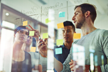 Aufkleber - Planning is the first step. Cropped shot of a group of young designers planning on a glass board.