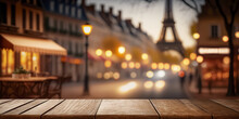 Wooden Table Top With A Glass Of Wine With A Blurred Gorgeous Night View Of The Eiffel Tower, Paris. Vacation Concept. For Mounting Your Product. Digital Art	