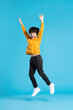 © Q88 - full body image of asian boy posing on blue background